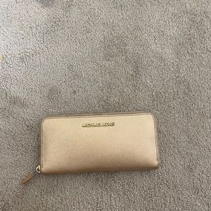 Michael Kors champagne colored wallet.